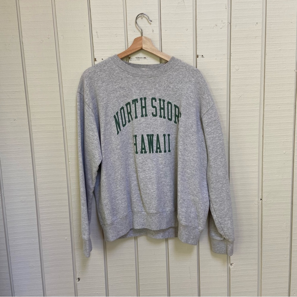 cozy, gray sweatshirt / jumper with text “North Shore Hawaii”